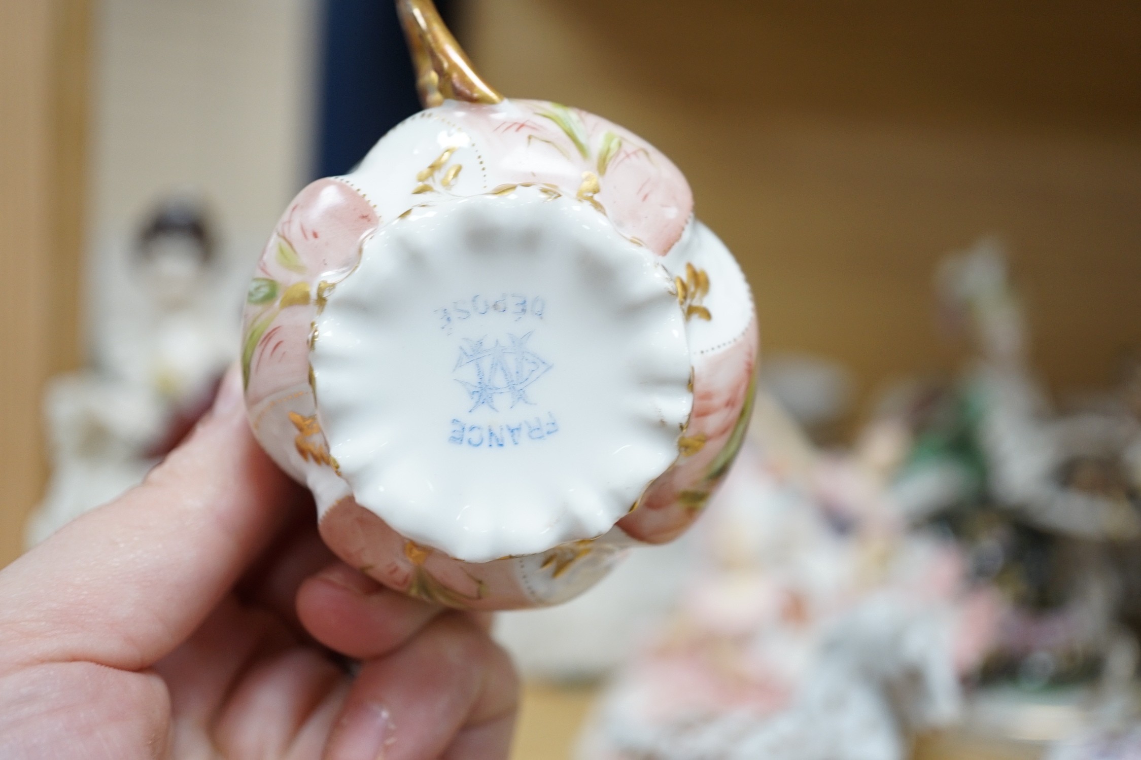 A group of Continental porcelain cabinet cups and saucers, a vase, crinoline figures and a Meissen horse, horse 9 cms high